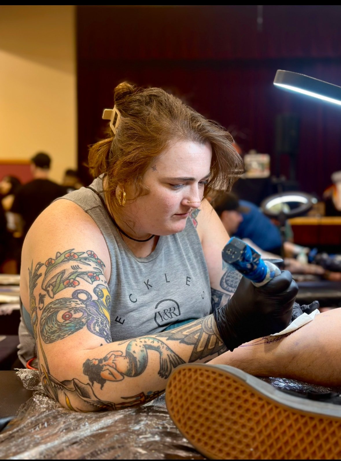 Elle working on some tattoos at luckys tattoo shop